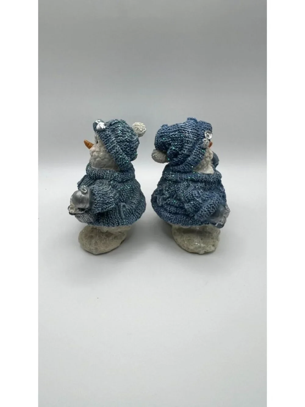 Set Of 2 Glittered Blue Snowman Figurines With Knitted Look Holding Birdhouse &